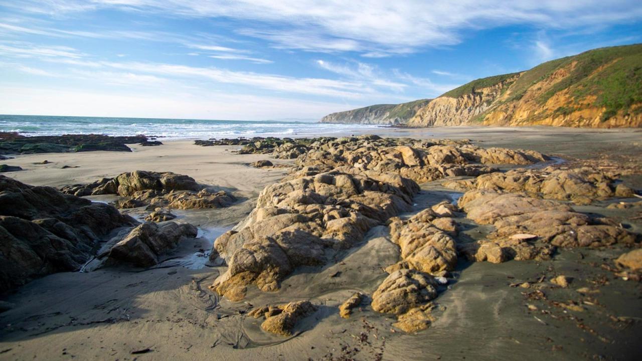 Normally covered with sand, heavy winter surf exposes ancient rocks on McClures Beach. NPS Photo / A. Kopshever