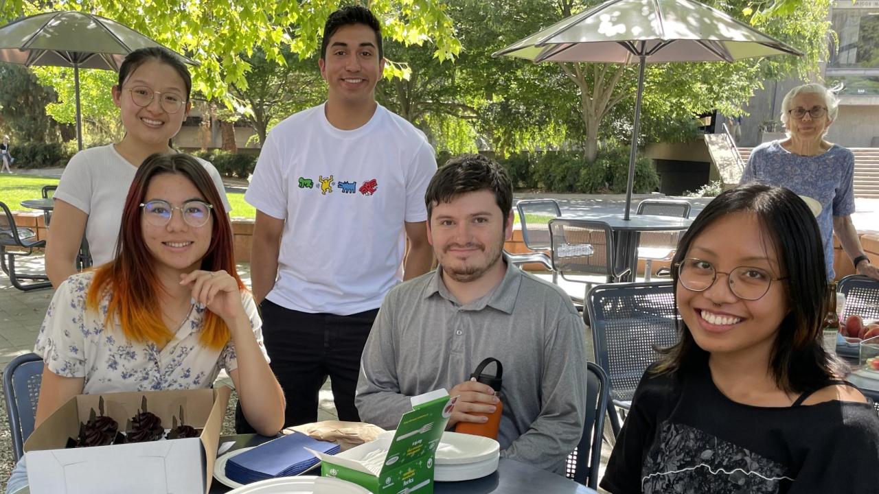 Class of 2024, from left: Winnie Sich, BS, major Computer Science, Caitlen Comendent, BA Design, Sebastien Trebels, BS Medical Molecular Microbiology, Stephen Shacoski, BS Plant Biology, Britney Solomon, BS Plant Science. Background, at right (not a recent graduate): Volunteer Kate Mawdsley