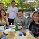 Class of 2024, from left: Winnie Sich, BS, major Computer Science, Caitlen Comendent, BA Design, Sebastien Trebels, BS Medical Molecular Microbiology, Stephen Shacoski, BS Plant Biology, Britney Solomon, BS Plant Science. Background, at right (not a recent graduate): Volunteer Kate Mawdsley